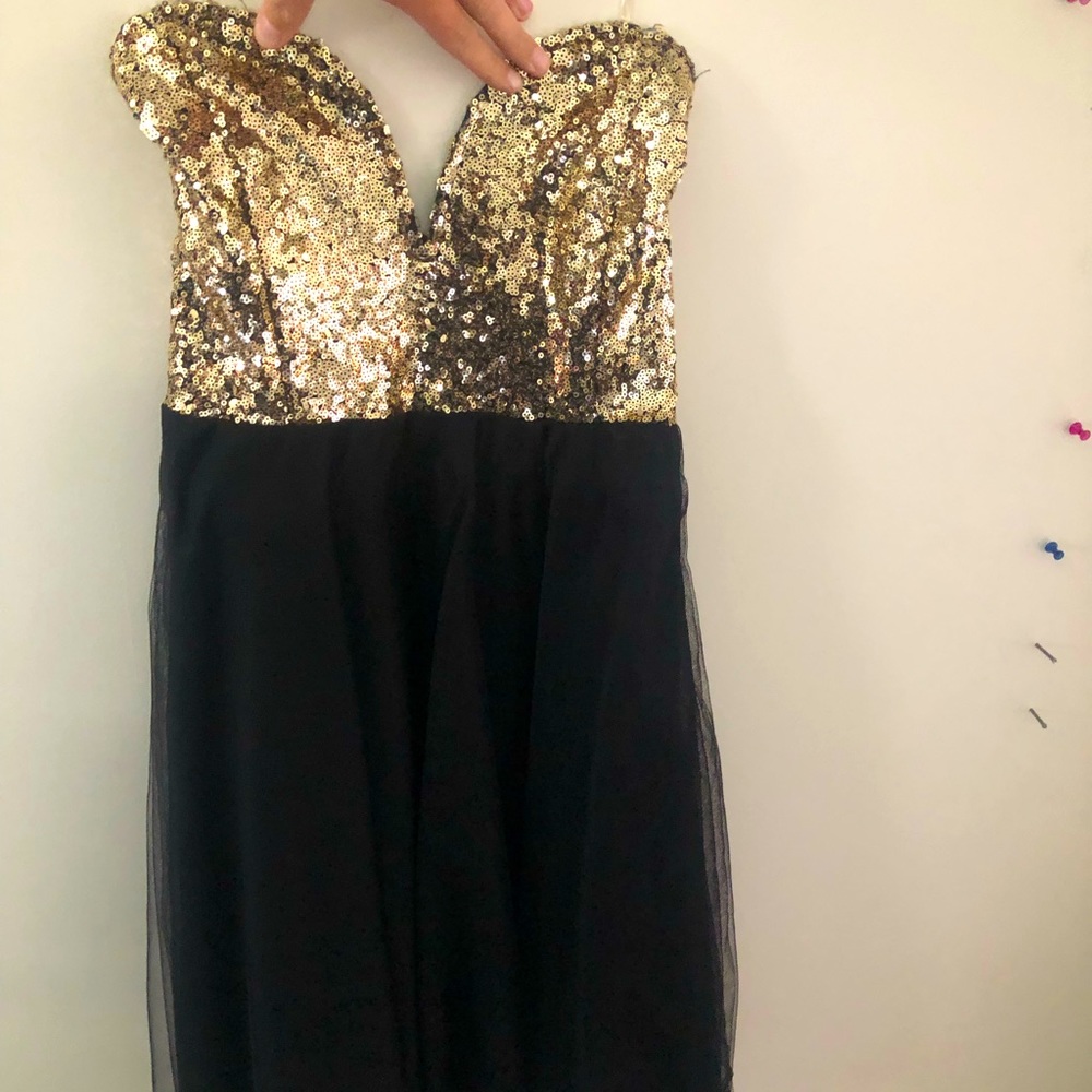 Black and gold sequin Charlotte Russe dress. Never been worn. Size extra small